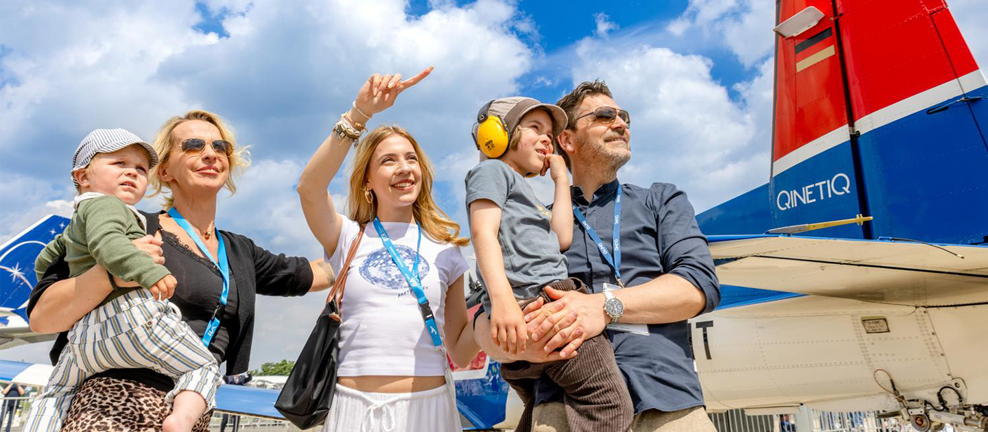 Family enjoying the ILA Public Days with aircraft in the background